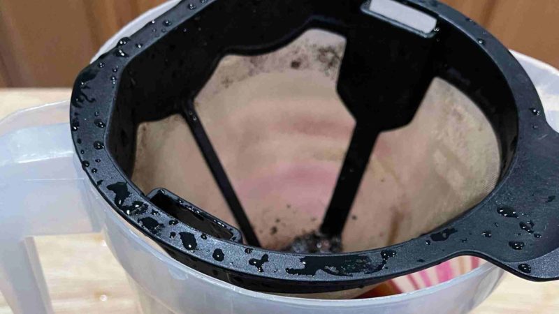 Straining cold brew coffee